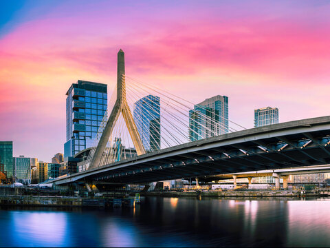 Zakim Bridge and Boston City Skyline over the Charles River at Sunset in Boston, Massachusetts, a beautiful vibrant modern cityscape of New England of America