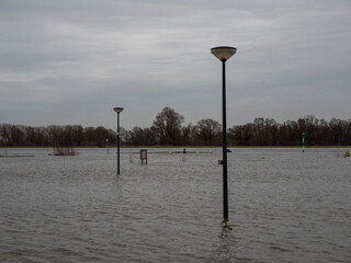 Flooded parkingplace by the river Nederrhine in the Netherlands. Place: Wijk bij Duurstede