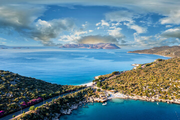 Aerial view of the touristic Kaş district and İnceboğaz beach with its lush green nature and...