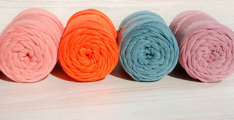 Colored skeins of cord for weaving macrame close-up.