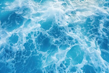  a view of the top of a boat in the ocean with a lot of foam on the water and the bottom part of the boat in the water.