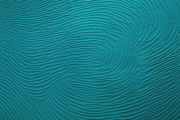  a close up view of a blue wall with wavy lines on the surface of the wall and the surface of the wall.