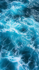 Top view of blue frothy sea surface. Shot in the open sea from above.