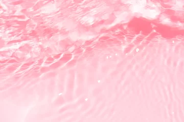 Foto op Aluminium Pink water splashes on the surface ripple blur. Defocus blurred transparent pink colored clear calm water surface texture with splash and bubble. Water waves with shining pattern texture background © Water 💧 Shining 📸