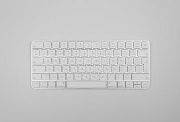 Top view of white keyboard on light grey background. Modern office flat lay, copy space.