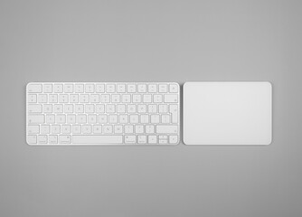 Top view of white keyboard, touchpad on light grey background. Modern office flat lay, copy space.