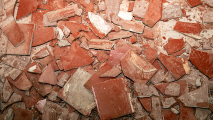 Fragments of shattered tiles scattered across the floor mark the commencement of a renewal and the...