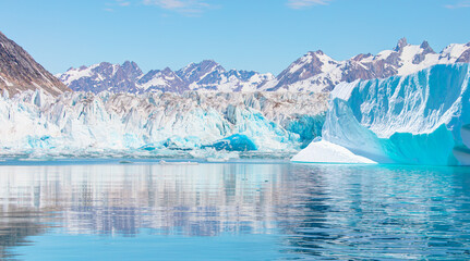 Knud Rasmussen Glacier near Kulusuk - Melting icebergs by the coast of Greenland, on a beautiful...