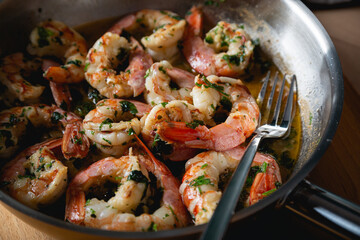 Fried langoustines, shrimp in white wine with garlic and parsley
