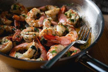 Fried langoustines, shrimp in white wine with garlic and parsley
