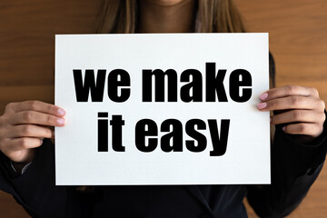 We make it easy. Woman with white page, black letters. Easy goinng, motto, slogan, cool attitude.