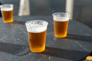 plastic cups with beer