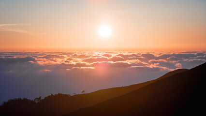 Sunset above the clouds
