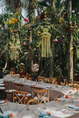 Arrangement decoration for intimate gathering with families or friends. Indonesian culture. Balinese, Javanese. Flower drops and hanging ornaments. Table setting. Long dinner table