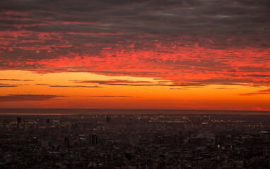 Glowing red sunset over Barcelona city