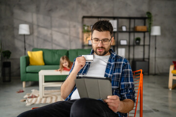 Man caucasian male online shopping use digital tablet hold credit card