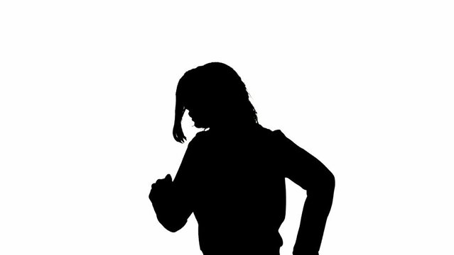 Black silhouette of a woman on a white isolated background. A young girl runs, fearfully looking around, fleeing faster from danger. Side view.