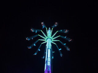 illuminated carousel in a city at night