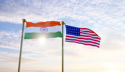 United States and India flags waving against a blue sky. 4K ULTRA HD. 