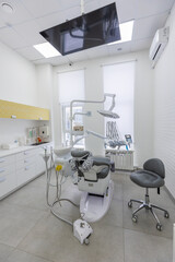 Modern Dental office. equipment at dental office. Dental chair and other accessories. Dental clinic equipment.