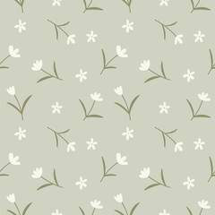 Delicate naive seamless vector pattern with small flowers on a pastel green background.