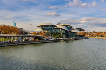 Kura river and Public Service Hall building in Mtatsminda district of Tbilisi, Georgia © ssmalomuzh