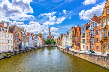 Spiegelrei water canal, Poortersloge Burghers' Lodge tower and medieval buildings on embankment in...