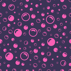 Pink soap bubbles on a dark purple background.