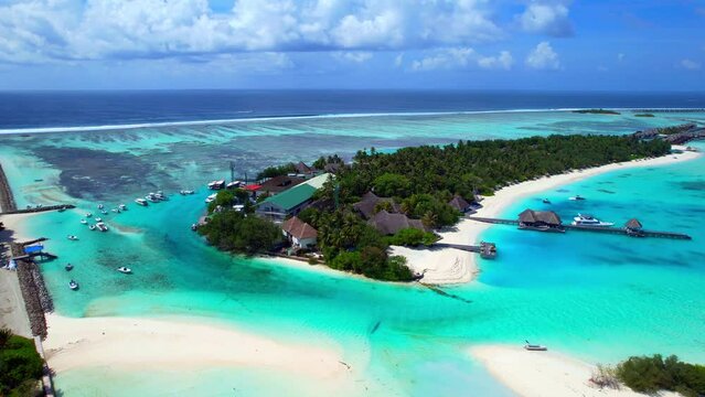 Kuda Huraa Island - Maldives - Left-hand flight shot over the island of Kuda Huraa to Huraa