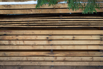 Wood background: Stacked boards of different thicknesses. Cut wood in a pile