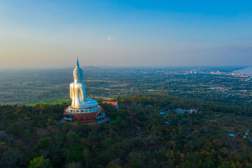 Top view Aerial photo from flying drone.Big Buddha Wat Phu Manorom Mukdahan Thailand.Buddha on the...