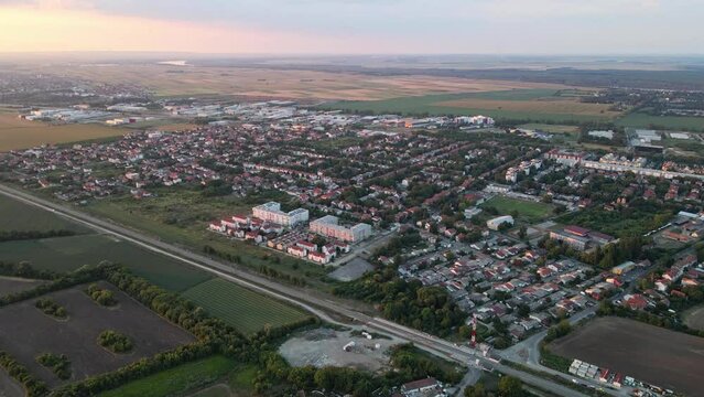 Drone slowly flies towards Zemun in Belgrade, Serbia in sunrise