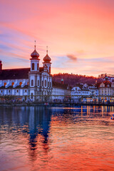 Splendid sunset over the  Jesuit church in the evening and Rathaussteg in Christmas illumination,...