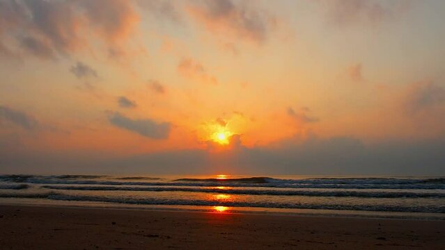 sunrise on the seabeach with orange sky cloud