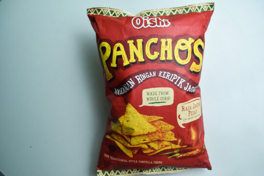 Oishi Panchos spicy corn flavor. Oishi brand is a manufacturer of food and drink products isolated on white background. Bekasi, Indonesia, Januay 4, 2023