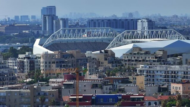 Aerial Backward Shot Of Bloomfield Football Stadium In City On Sunny Day - Tel Aviv-Yafo, Israel