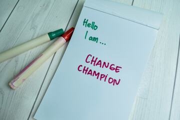 Concept of Hello I am.. Change Champion write on book isolated on Wooden Table.