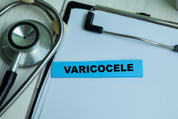 Concept of Varicocele write on sticky notes with stethoscope isolated on Wooden Table.