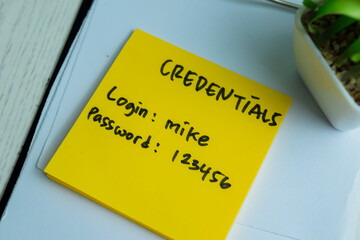 Concept of Credentials, Login and Password write on sticky notes isolated on Wooden Table.