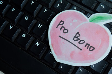 Concept of Probono write on sticky notes isolated on keyboard.