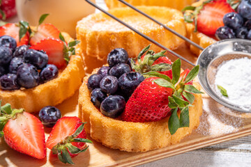 Sponge mini tart cakes with summer berry