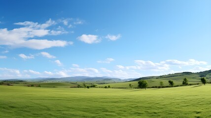 Fototapeta premium A panoramic view of a rural countryside with rolling hills and a clear blue sky