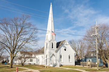 The Dwight pioneer gothic church, built in 1857, in the morning sun.  Dwight, Illinois, USA.