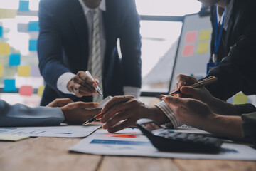 Co working conference, Business team meeting present, investor colleagues discussing new plan financial graph data on office table with laptop and digital tablet, Finance, accounting, investment.