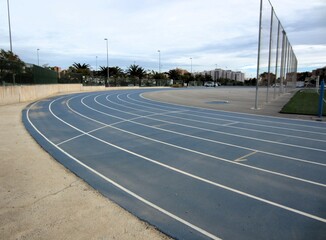 blue running track with lanes