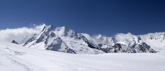 Mountain panorama. Caucasus, Dombay. View from the ski slope. - 702903557