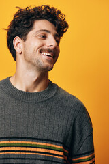 Fototapeta premium Man background orange sweater trendy portrait fashion