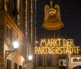 Christkindlesmarkt or Christmas Market or Weihnachtsmarkt whit Christmas illuminations in Nuremberg, Germany - 702905565