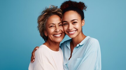 Joyful charming enjoyable content senior mother with grown-up daughter two ladies together in casual attire embracing embrace gaze at camera - obrazy, fototapety, plakaty