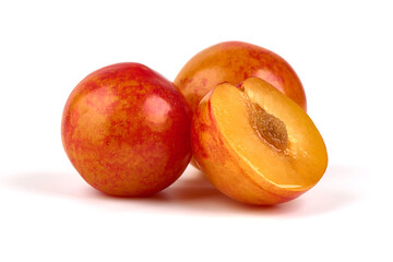 Yellow plums, isolated on white background.